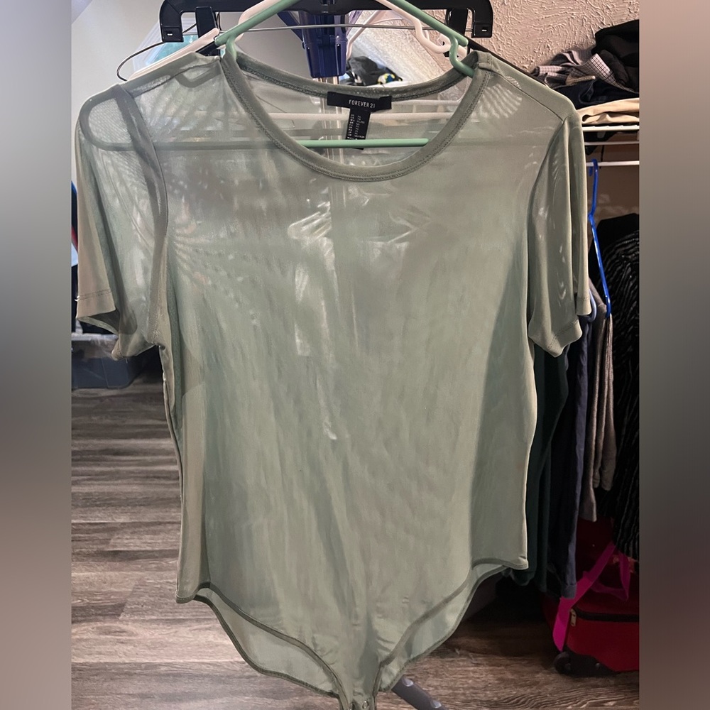 See-through green bodysuit